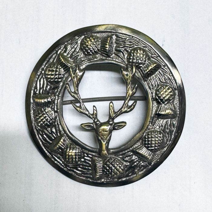 Antique stag head brooch with detailed antlers in vintage brass finish for Highland attire