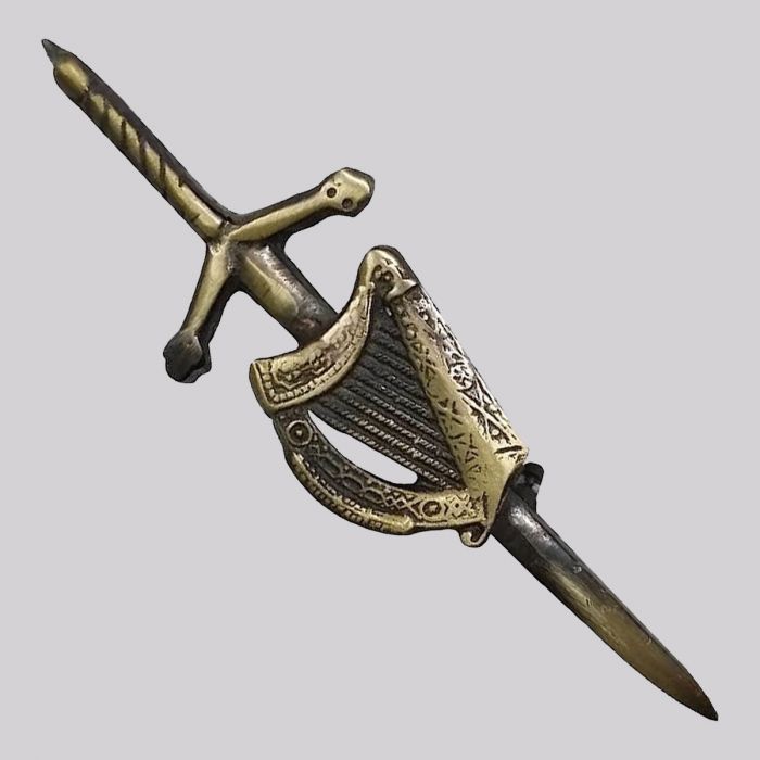Decorative sword with intricate design on a gray background