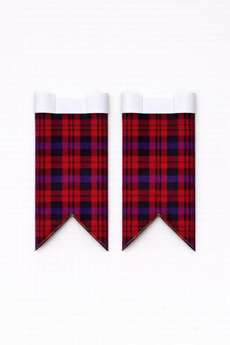 Handmade brown tartan kilt with traditional pleats and leather straps
