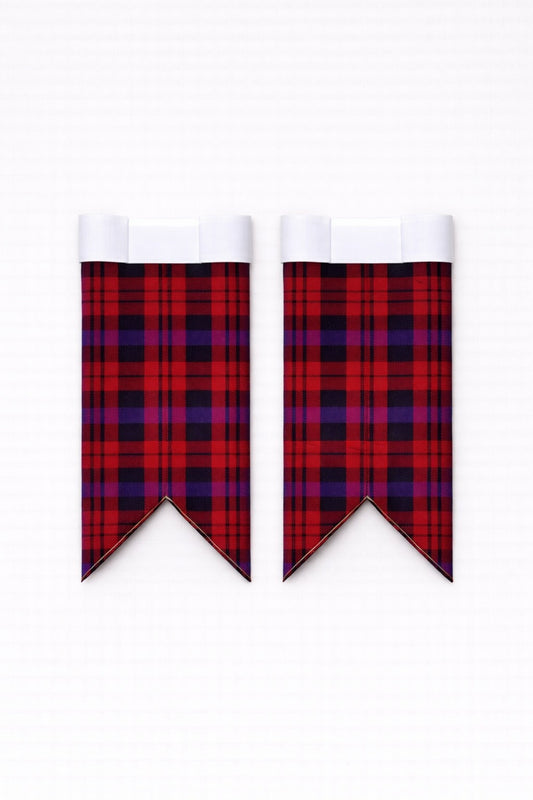 Handmade brown tartan kilt with traditional pleats and leather straps
