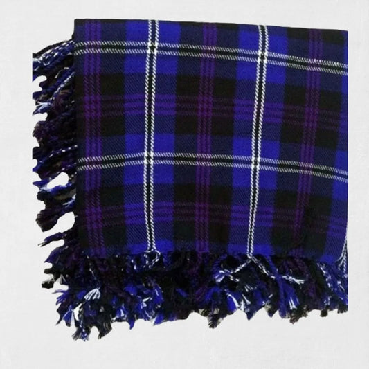 Heritage of Scotland tartan fly plaid in purple and navy draped on formal Highland outfit.