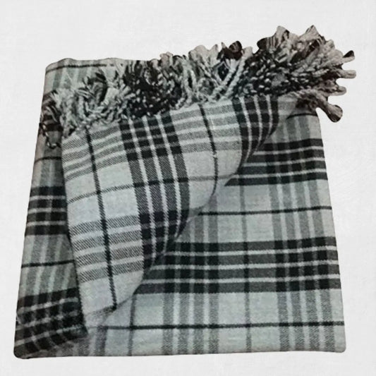 Hunting Stewart tartan fly plaid in green, red, and navy worn with formal Highland outfit.