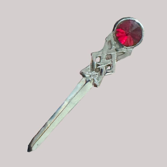 Scottish Kilt Pin with Red Stone on Tartan Fabric – Highland Dress Accessory