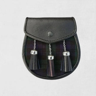 Black leather sporran with silver tassels on light gray background.