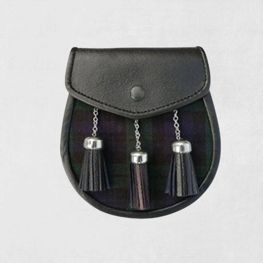 Black leather sporran with silver tassels on light gray background.